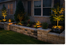 Landscape lighting near a stone wall
